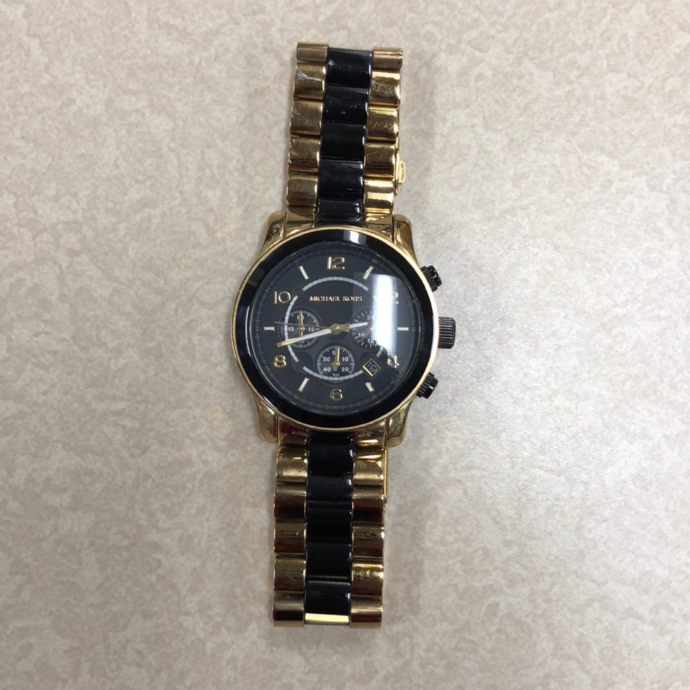 Michael Kors gold and black trim men’s watch